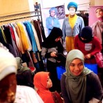 Guests check out clothes on display at a fashion bazaar during a two-day Islamic Fashion Festival at a hotel in Jakarta Guests check out clothes on display at a fashion bazaar during a two-day Islamic Fashion Festival at a hotel in Jakarta